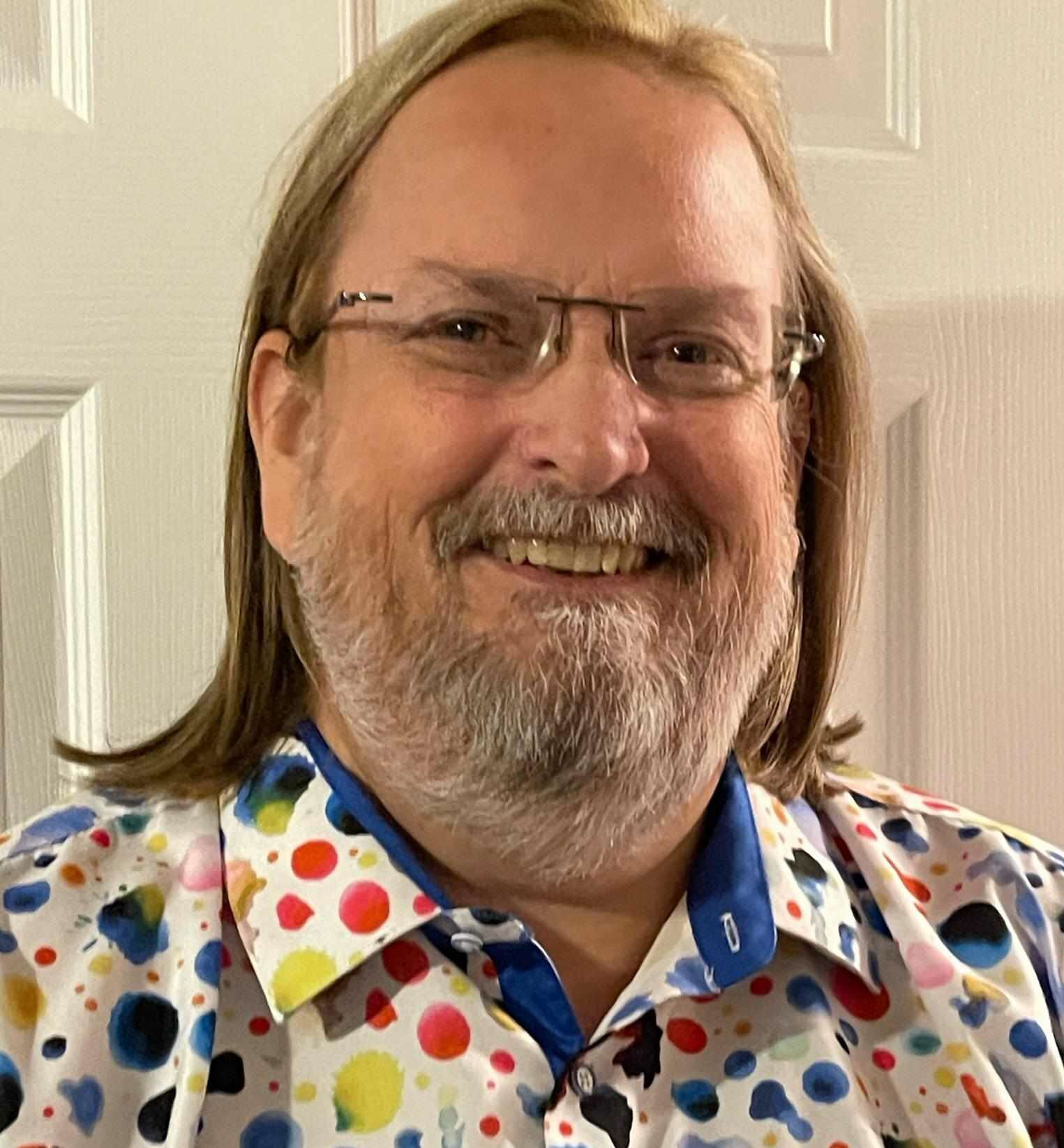 picture of a man with a colorful shirt on